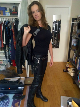 Fem-Tom shown here in his natural habitat, surrounded by jewel-tone accessories and books about yoga.